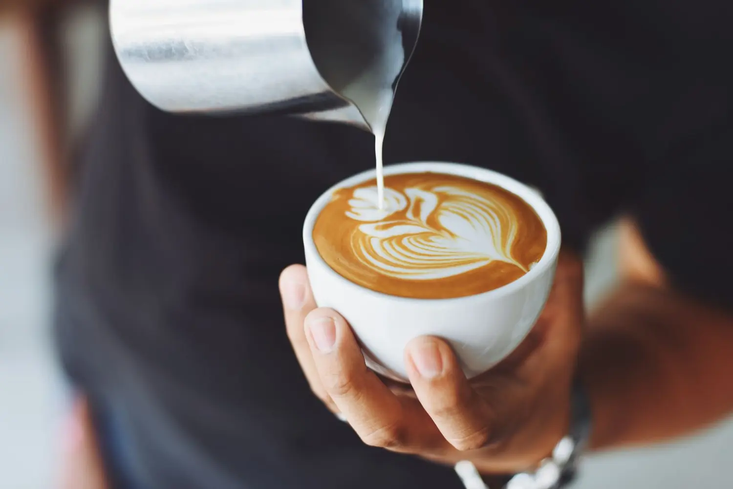 Illustrative photo of espresso pouring into a glass cup. Not a General Vending machine.
